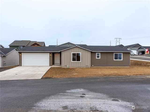 ranch-style home featuring a garage