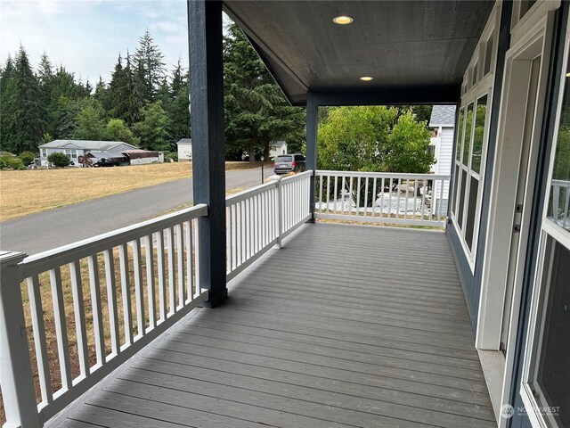 wooden terrace with a porch