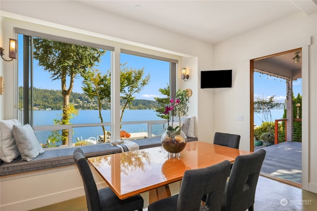 dining area featuring a water view