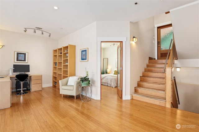 living area with light hardwood / wood-style flooring