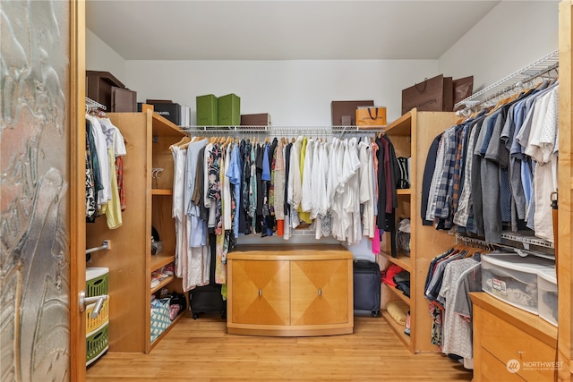 spacious closet featuring light hardwood / wood-style flooring