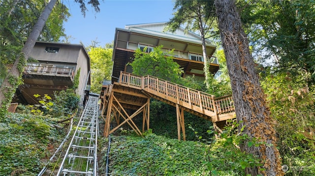 back of house featuring a deck