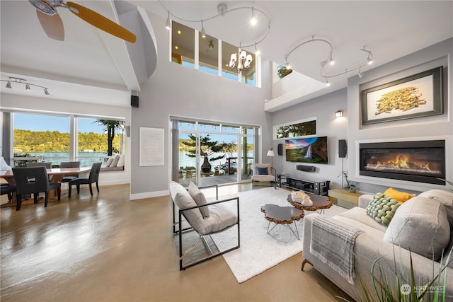 living room featuring ceiling fan and track lighting