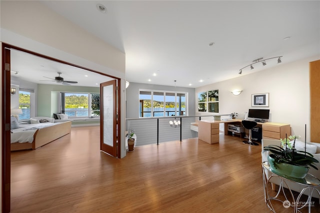 interior space featuring ceiling fan and light hardwood / wood-style floors