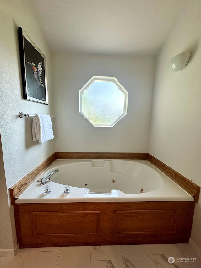 bathroom featuring a washtub