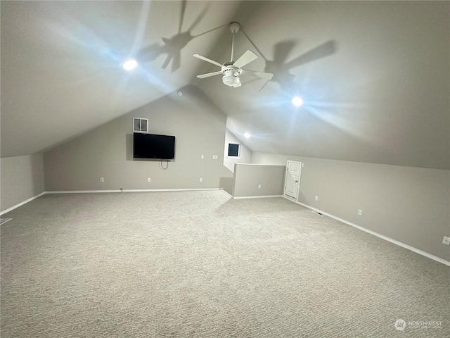 bonus room with vaulted ceiling, carpet floors, and ceiling fan