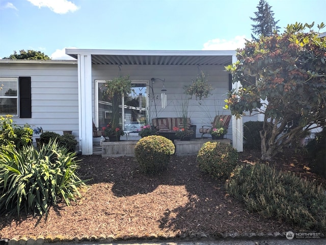 back of property with covered porch