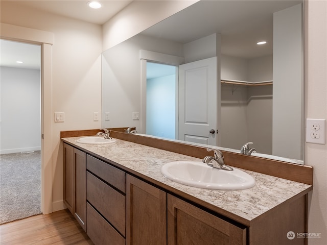 bathroom with vanity and hardwood / wood-style flooring