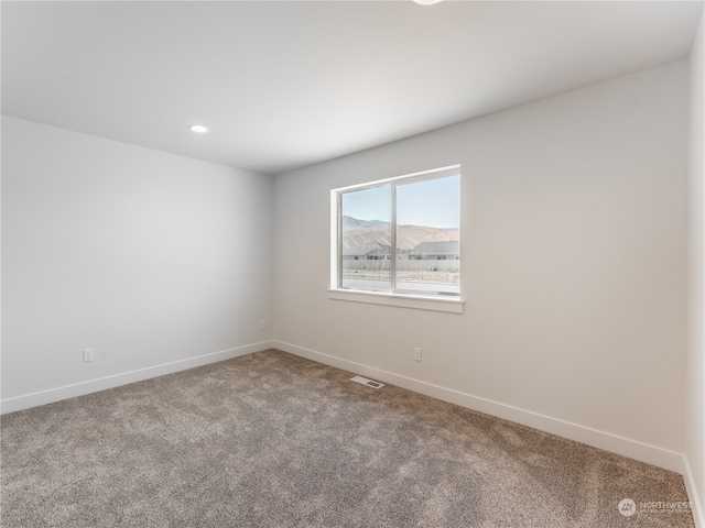 unfurnished room featuring carpet floors