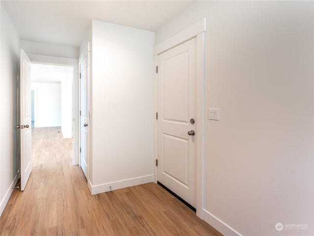 hallway with light wood-type flooring