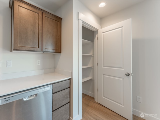 kitchen with dishwasher and light wood-type flooring