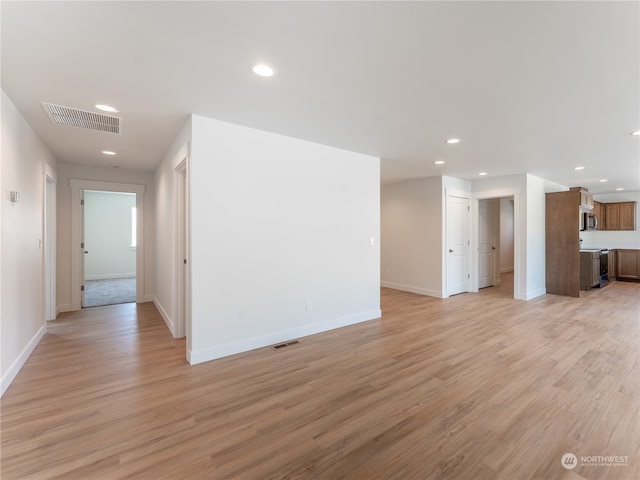 unfurnished living room featuring light hardwood / wood-style floors