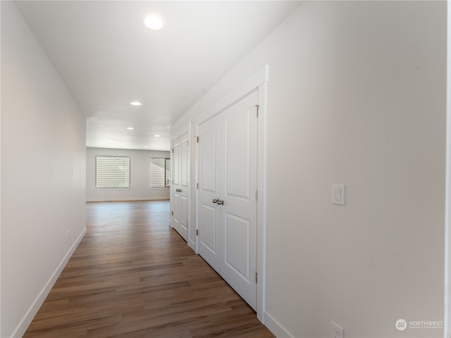 corridor featuring dark hardwood / wood-style floors