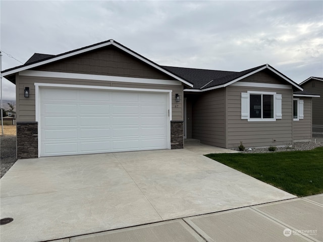 view of front facade with a front lawn and a garage