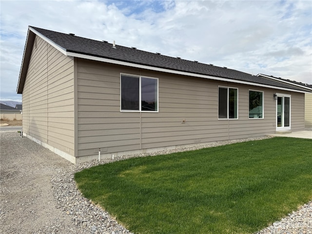 view of side of property featuring a yard