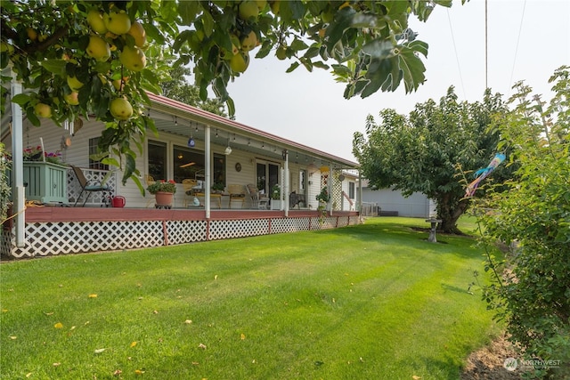 view of yard with a wooden deck