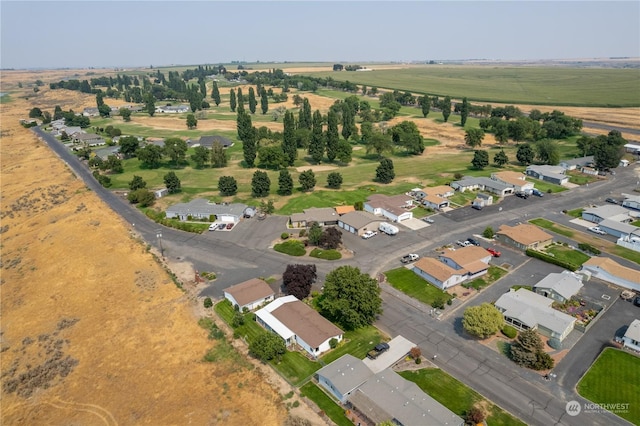 birds eye view of property featuring a rural view