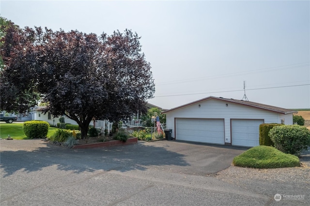 view of front of property featuring an outbuilding and a detached garage