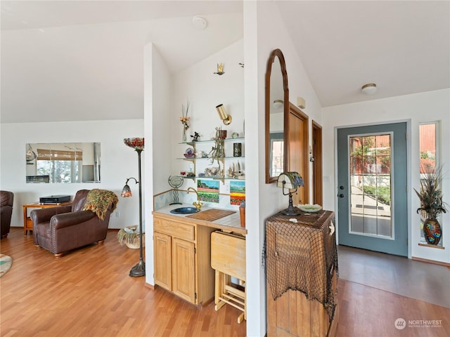 interior space with lofted ceiling and light wood finished floors