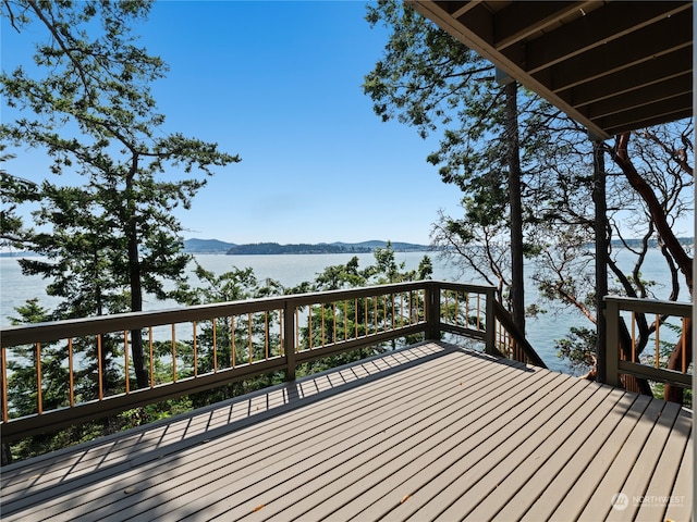 wooden deck with a water view