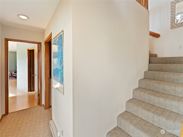 staircase featuring hardwood / wood-style floors