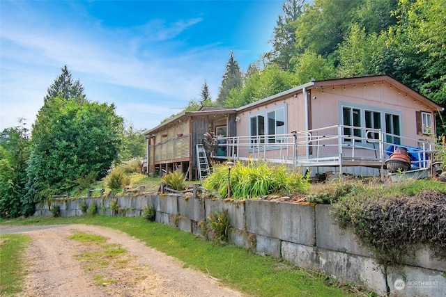 view of front of home with a wooden deck