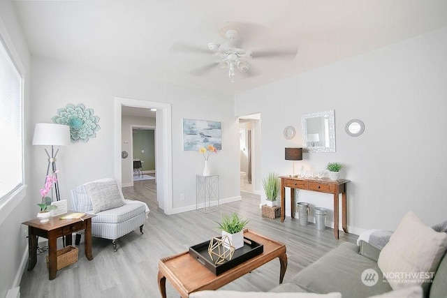 317 2nd Ave NW, Kelso, WA 98626 - living area featuring ceiling fan, light wood-type flooring, and baseboards