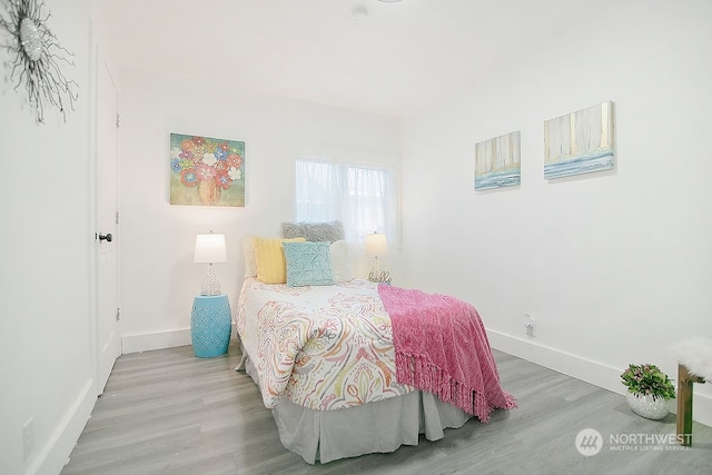 bedroom featuring wood-type flooring