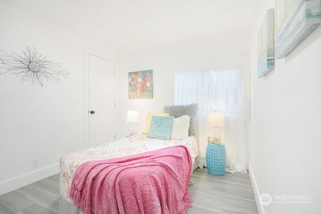 317 2nd Ave NW, Kelso, WA 98626 - bedroom with wood finished floors and baseboards