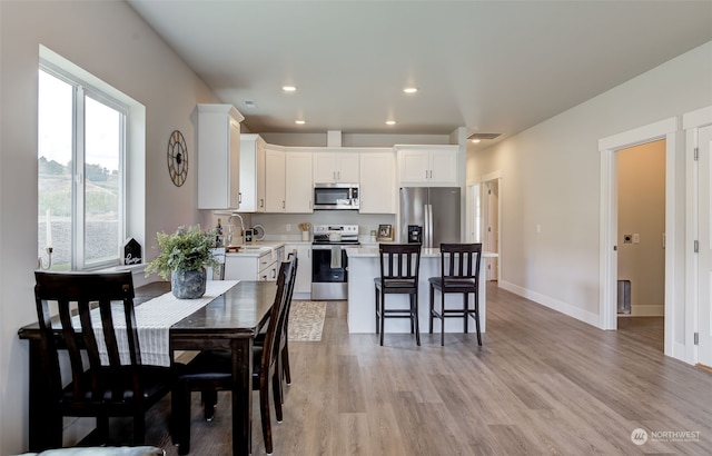 dining room with light hardwood / wood-style floors