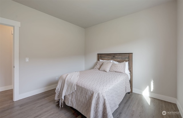 bedroom with hardwood / wood-style flooring