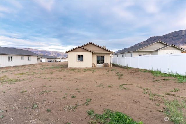 rear view of house with a mountain view