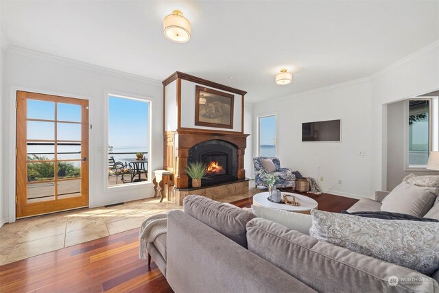 tiled living room featuring crown molding