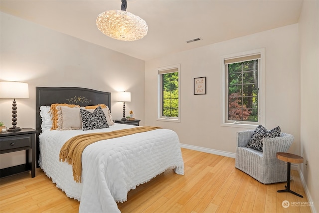 bedroom with light hardwood / wood-style floors