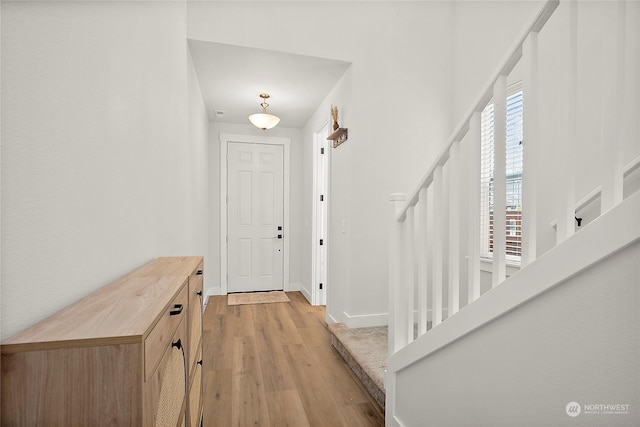 foyer entrance with light wood-type flooring