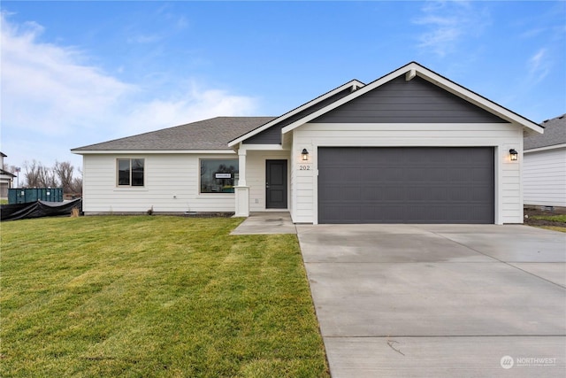 ranch-style home featuring a garage and a front lawn