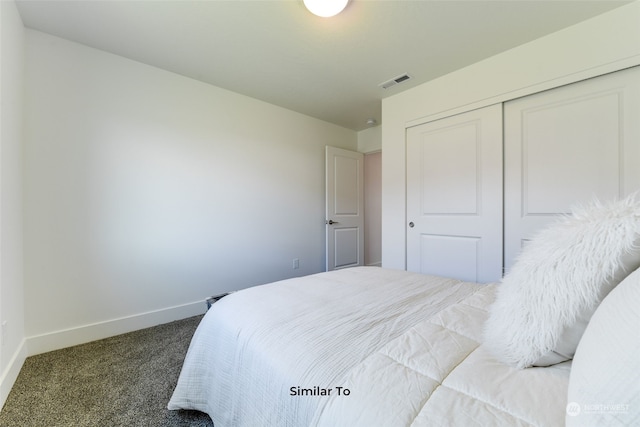 bedroom featuring a closet and carpet