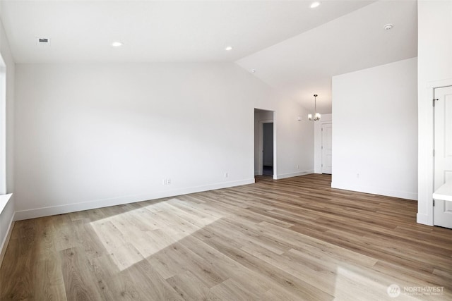 unfurnished room with recessed lighting, baseboards, vaulted ceiling, light wood finished floors, and an inviting chandelier