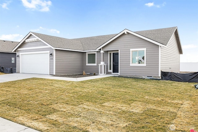 ranch-style home with a shingled roof, a front yard, driveway, and an attached garage