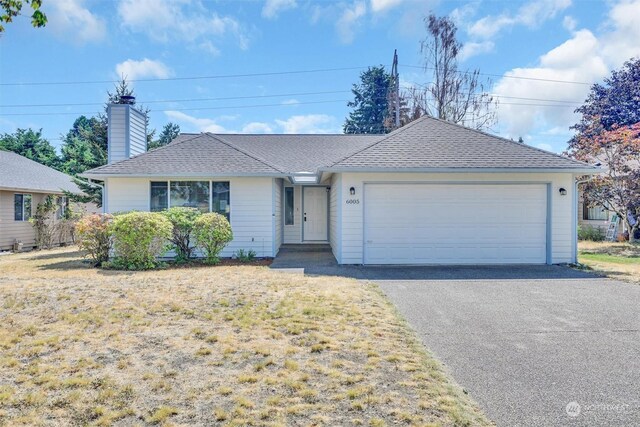 ranch-style home with a garage