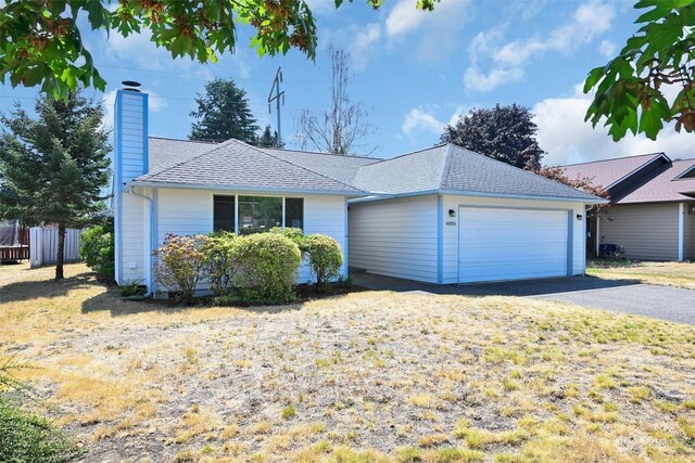 ranch-style home with a garage