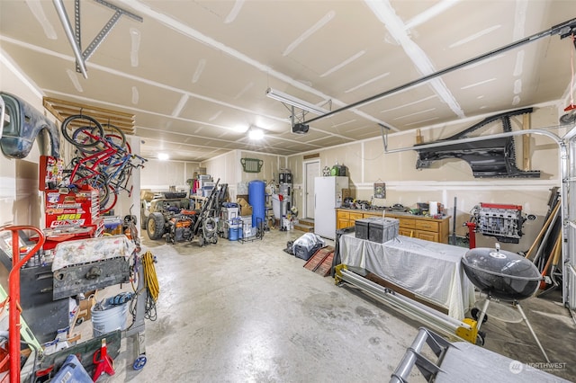 garage featuring a workshop area and a garage door opener