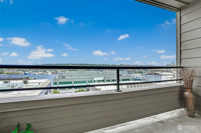 balcony featuring a water view