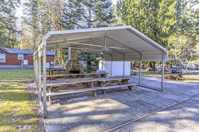 view of parking / parking lot featuring a carport