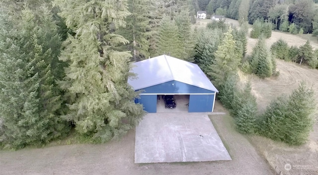 drone / aerial view featuring a view of trees