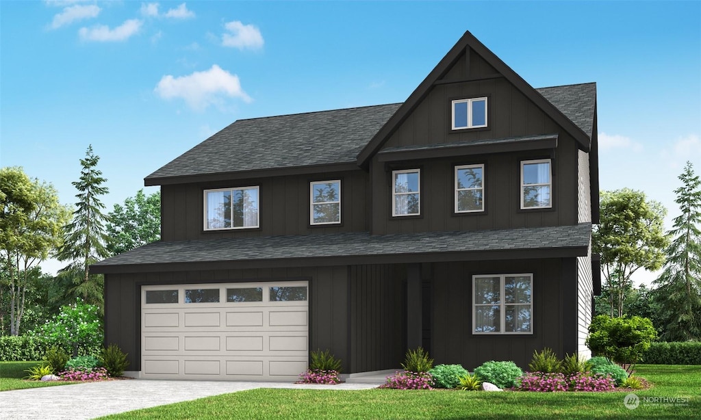 view of front of property with a garage and a front yard