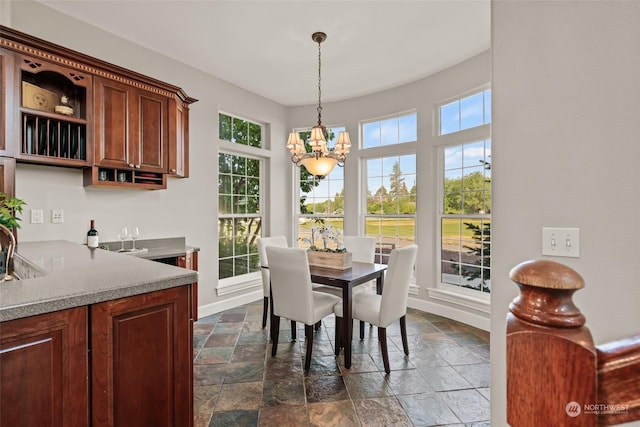 dining area with an inviting chandelier