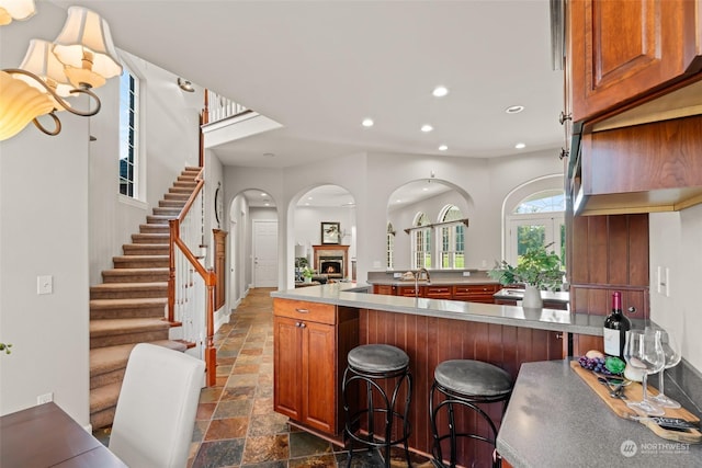 kitchen featuring kitchen peninsula and a breakfast bar area