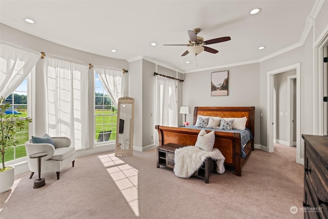 bedroom with ceiling fan, light colored carpet, and ornamental molding