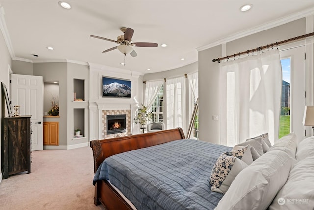 carpeted bedroom with ornamental molding and ceiling fan